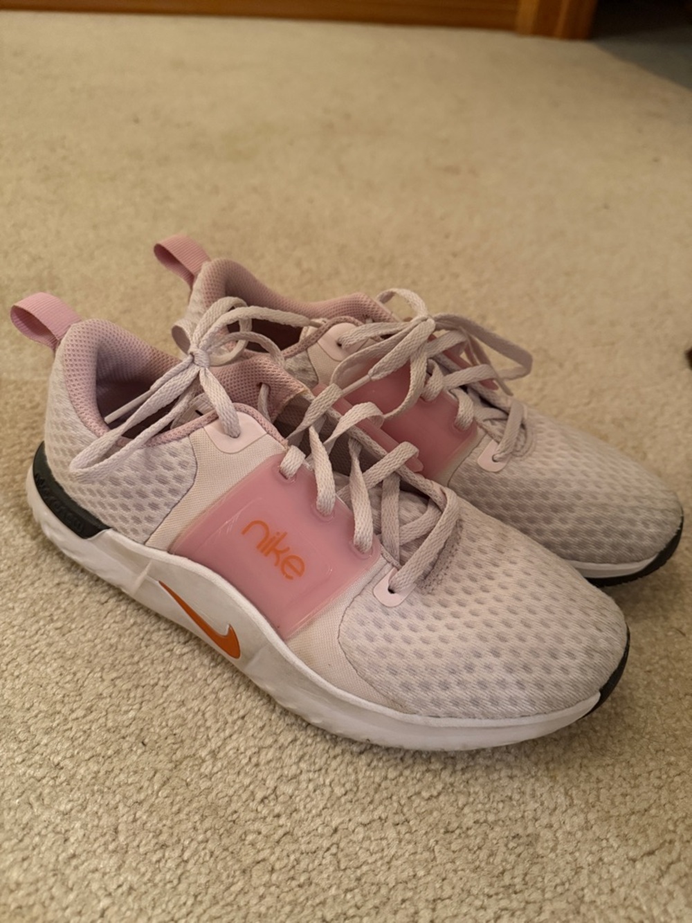 Nike Women’s Light Pink and White Sneakers with Orange Swoosh